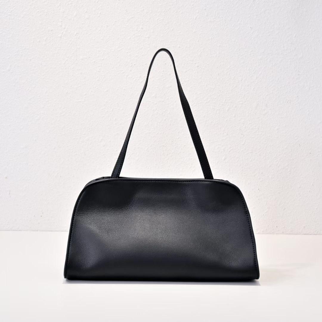 

2025 Новый минималистский стиль Нишевый дизайн Высококачественная кожаная сумка через плечо Сумка через подмышку Диагональная крестовая женская сумка 28x16x16cm чёрный