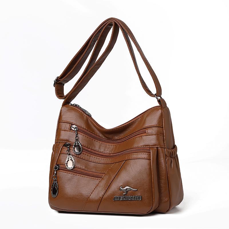 

Простая и элегантная одноплечевая сумка кроссбоди для женщин среднего возраста с мягкой кожей и множеством карманов светло-коричневого