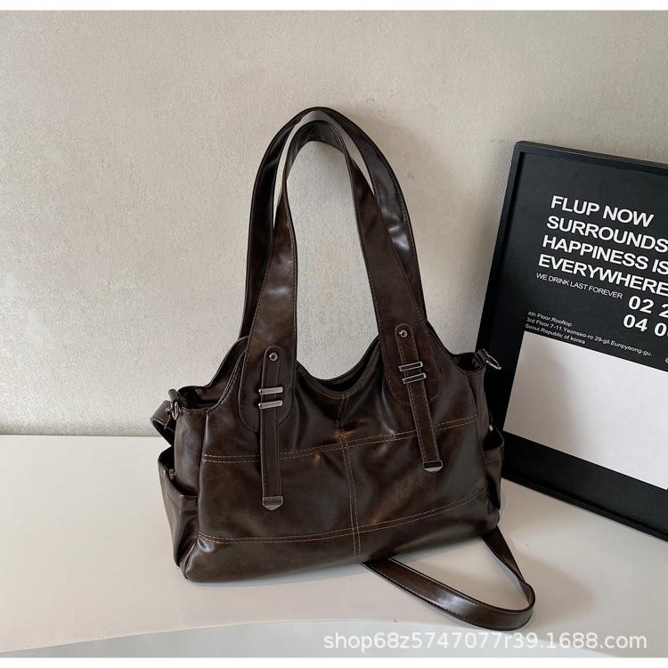 

Fashion retro large-capacity armpit bag women s bag 2025 new high-end casual tote bag oil wax leather crossbody commuting темно-коричневого кольору