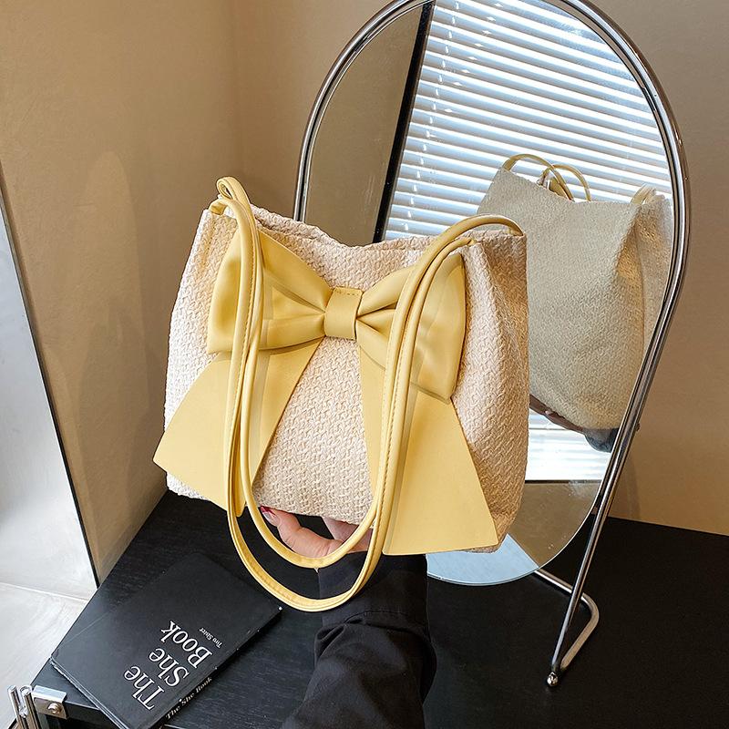 

Bow small bag women s new fashion commuter straw bag bucket bag summer versatile armpit bag жовтий