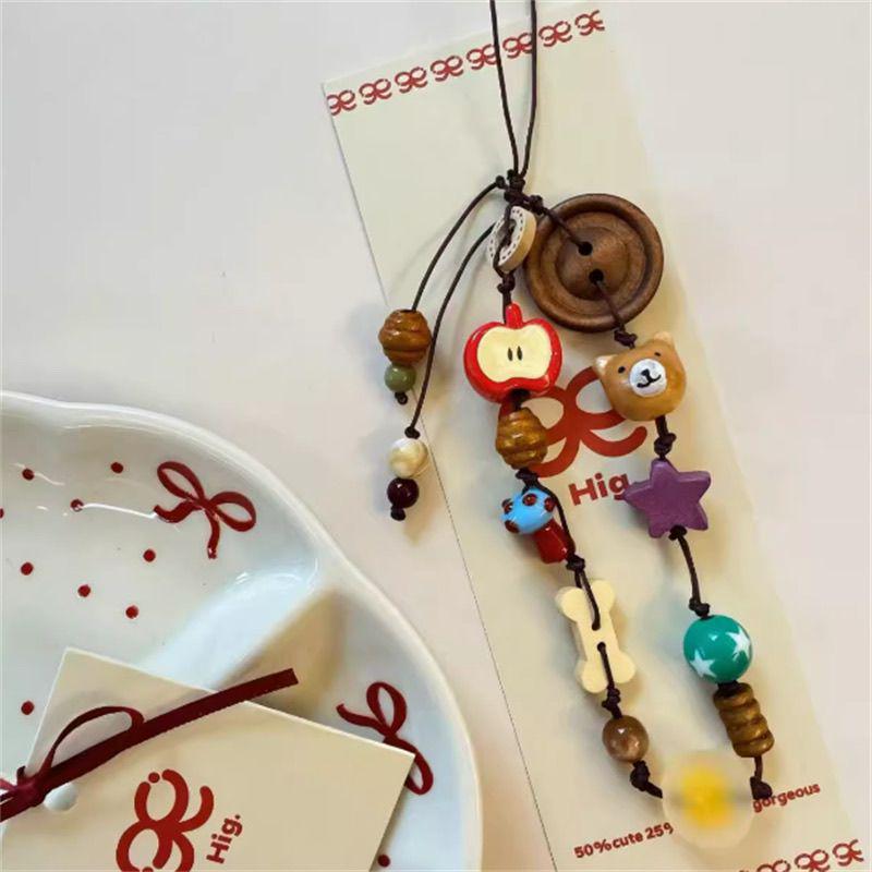 

Chic Apple Bear Lanyard for Women: Stylish Bag and Camera Hanging Chain