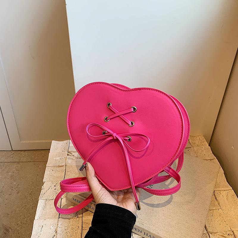 

Korean version of love handbag 2024 new only beautiful women bag niche design shoulder bag cute bow messenger bag рожевий