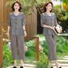 Mom's 2026 Chiffon Suit: Summer Fashionable Two-Piece Set for Middle-Aged and Elderly Women - Age-Reducing Top & Wide-Leg Pants.