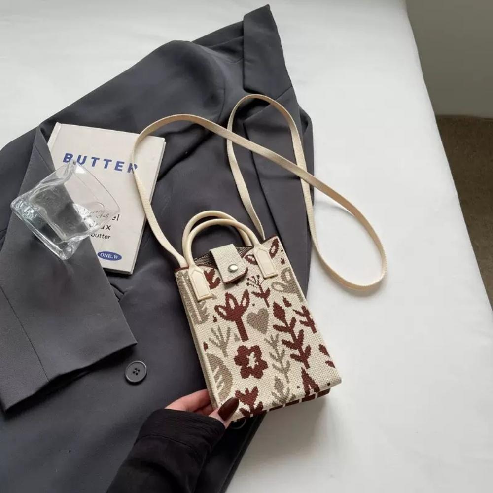 A Spacious Knitted Small Mobile Wallet with a Crossbody Strap, Suitable for Women Traveling with Small Items