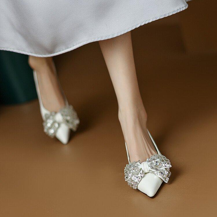 

Temperament retro shallow single shoes women s pointed head one pedal rhinestone bow low heel versatile 2025 spring new single shoes 40 слонова кістка