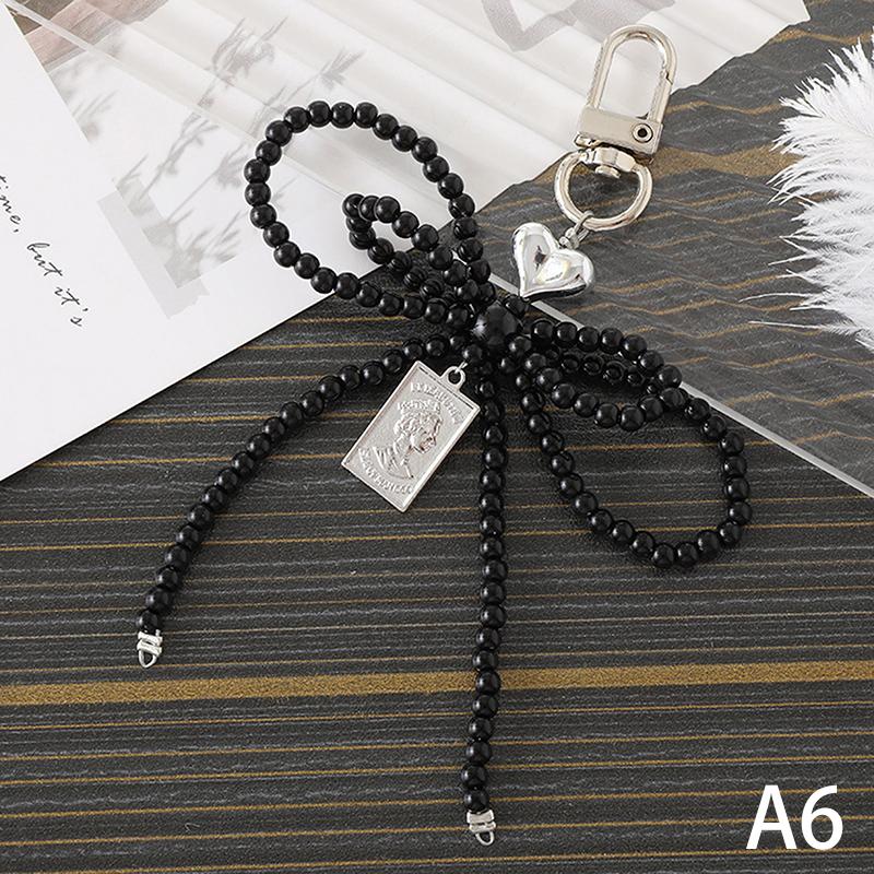 

Делікатний брелок з бісеру, ручної роботи, брелок у формі бантика, брелок у формі серця, орнамент, перлинні прикраси для сумок і телефонів as the picture