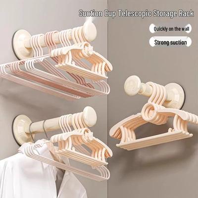 Telescopic Wall-Mounted Suction Cup Clothes Rack: No-Punch, No-Trace Storage Hanger for Balcony and Household Use.