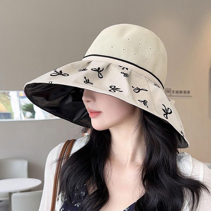 Hat women's spring and summer new bow knitted empty top hat vinyl sunscreen beach sunshade printing folding sun hat