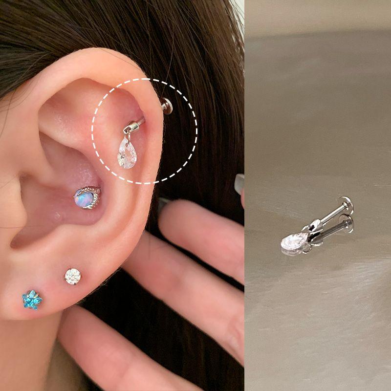 

Магазин колец для пирсинга Хеликс Кольцо для пирсинга ногтя Колесо для уха Пирсинг высокого уха Штанга для кости уха Титановая сталь Серьги-пусеты Титановый сплав Серьги Ноготь дьявола Water Drop 1