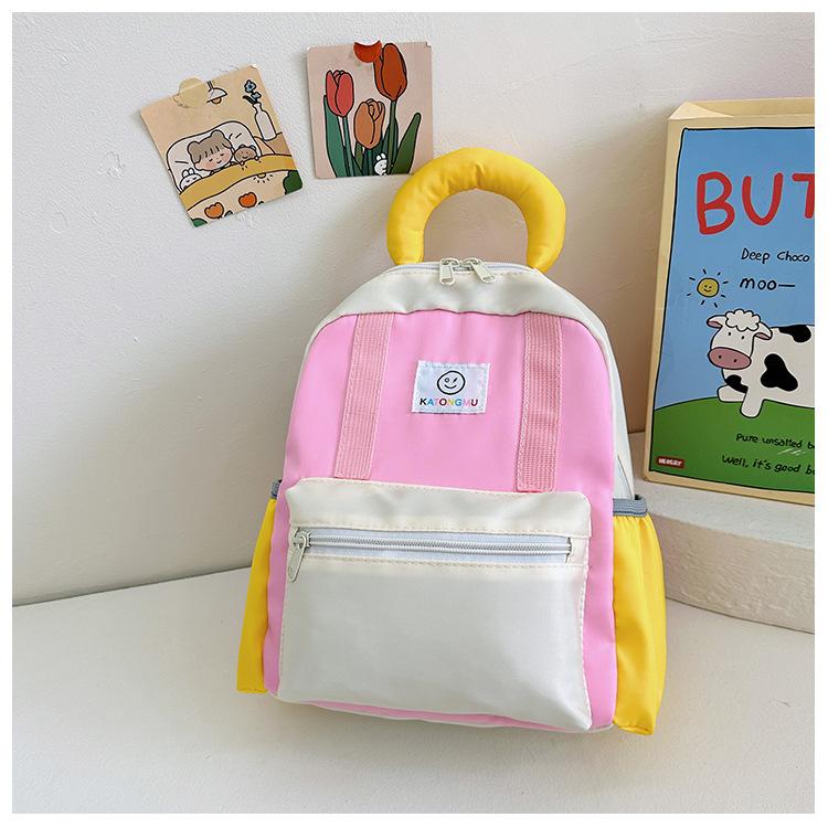 

New schoolbag men and women cute foreign trend backpack light casual snack bag рожевий