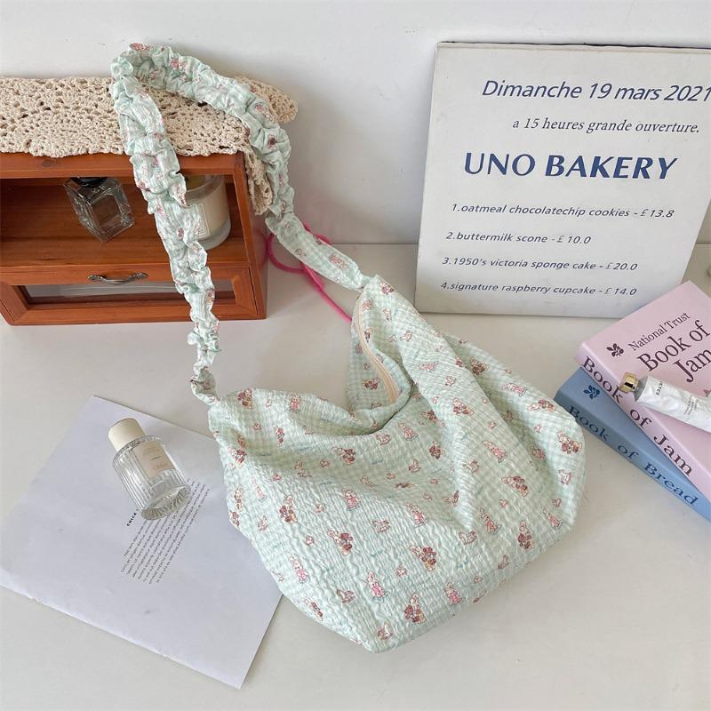 

ins simple armpit bag women s new largecapacity cartoon embossed fashion drawstring shoulder canvas bag