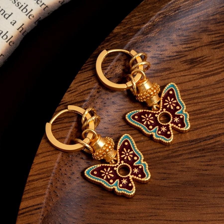 

Guochao painting contrasting color design butterfly three-dimensional alloy one multi-wear creative ear buckle золотий