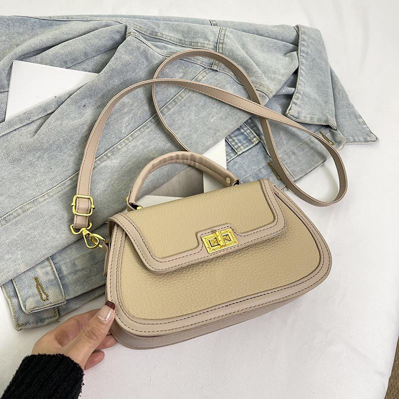 Spring niche design fashionable contrasting color saddle bag portable shoulder crossbody trendy women's bag