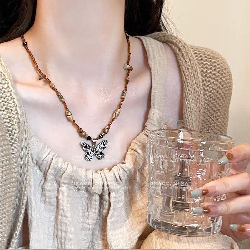 Bohemian Ethnic Style Long Bow Metal Necklace with Vintage Distressed Pendant (2025)