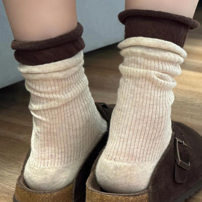 Grey Socks with Rolled-up Edges, Piles of Socks, Burken Shoes, Mid-calf Socks, and Contrasting Long Socks Are Trendy
