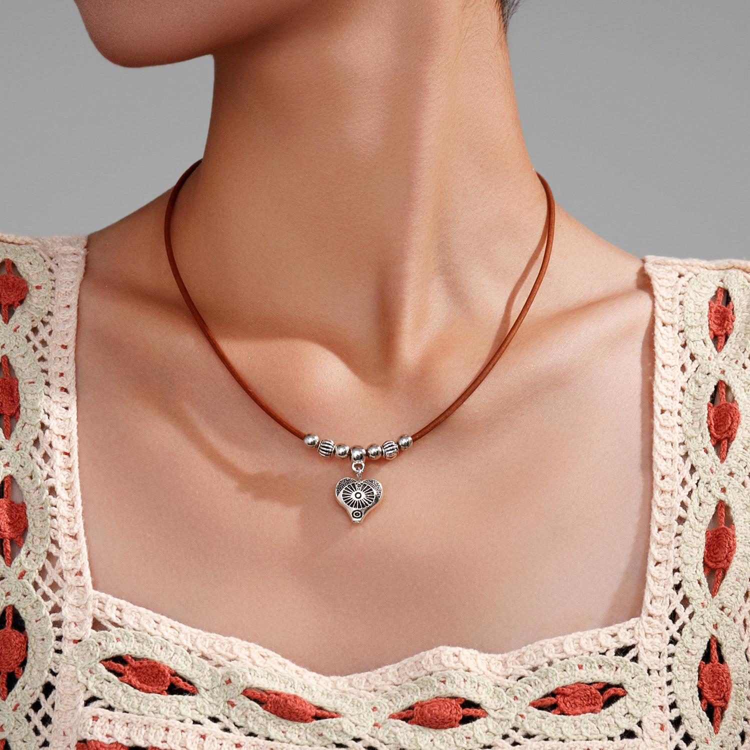 Bohemian style environmentally friendly alloy peach heart pendant, leather rope woven bead women s necklace