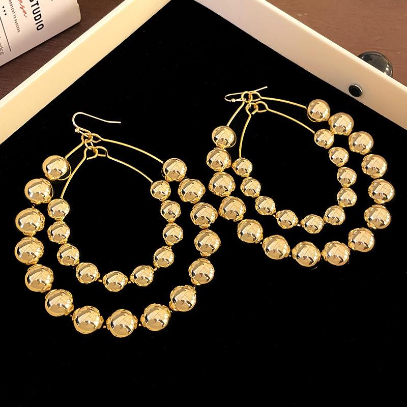 Double-layer exaggerated oval round ball ear hook European and American fashion cold wind earrings commuter personality temperament earrings