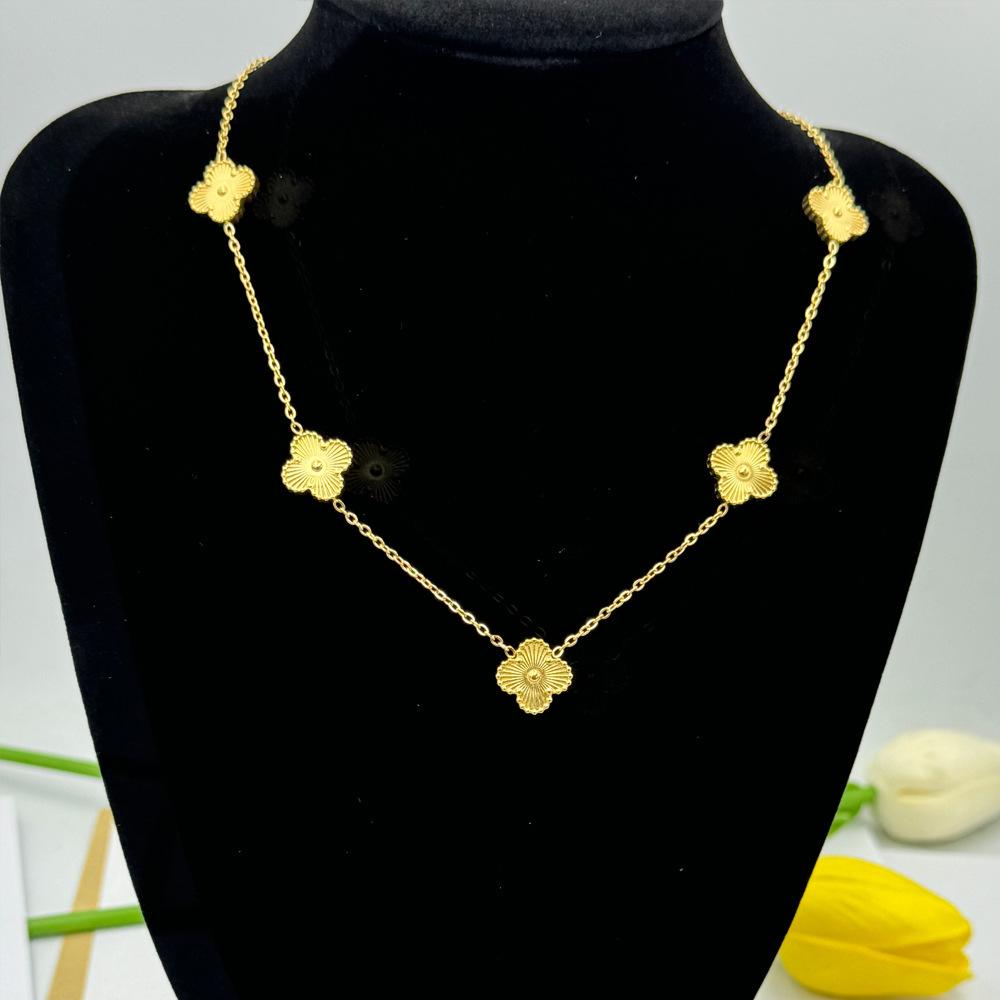 Collier de fleurs de trèfle à quatre feuilles pour la mode féminine, tempérament de luxe léger, chaîne de pull haut de gamme à sept fleurs