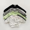 Korean-Style Unisex Baby Sweatshirt and Pants Set - Solid Color with Webbing Stripe Patchwork for Autumn and Spring.