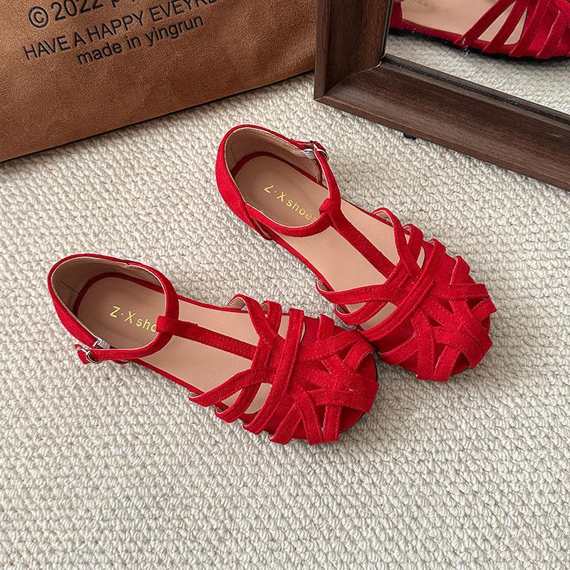 Woven flat-soled sandals women's summer retro outer wear hollowed-out baotou pig cage shoes one-button Roman shoes