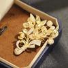 Elegant and exquisite full of zircon gold Longdu flower brooch temperament niche high-end bouquet pin coat accessories
