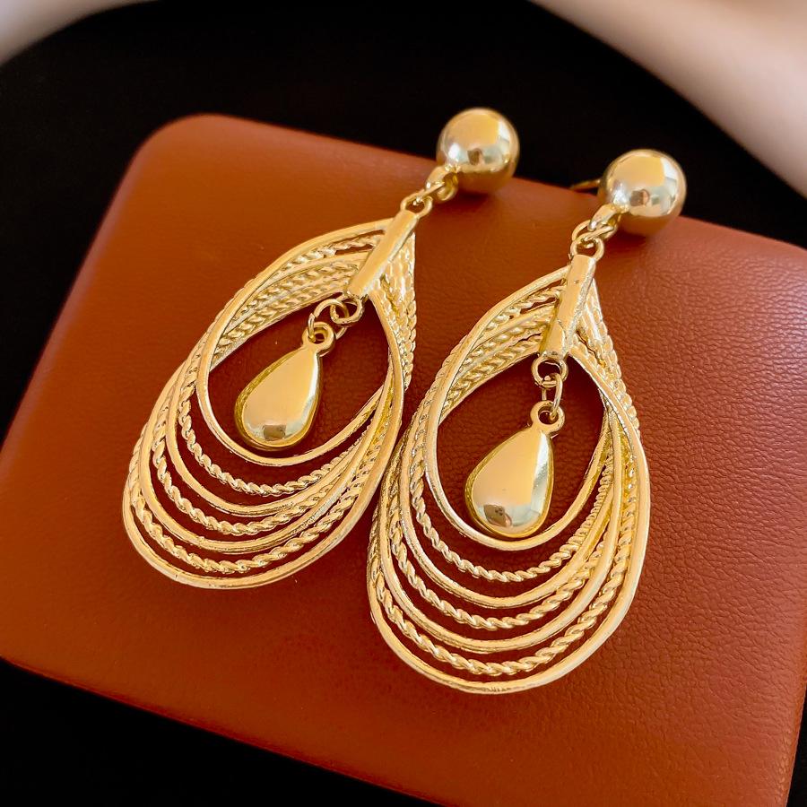 Chic Multi-Layer Twisted Teardrop Hollow Earrings with Elegant Design