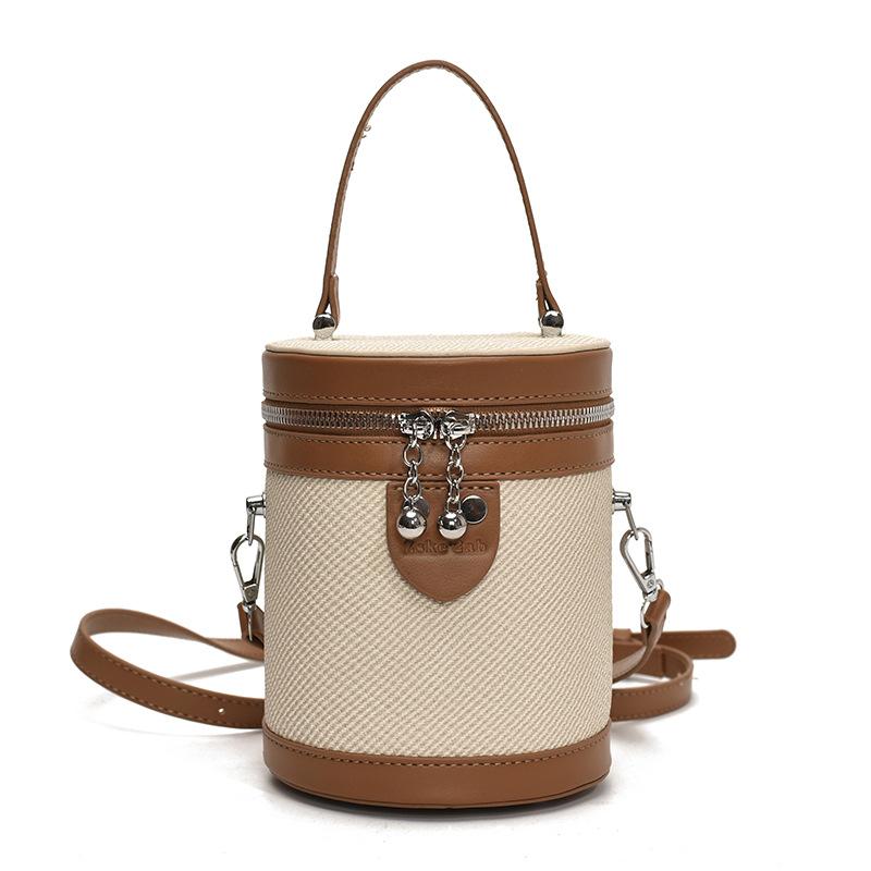 Niche design fashionable contrasting color portable canvas bag women's spring new versatile messenger bucket bag