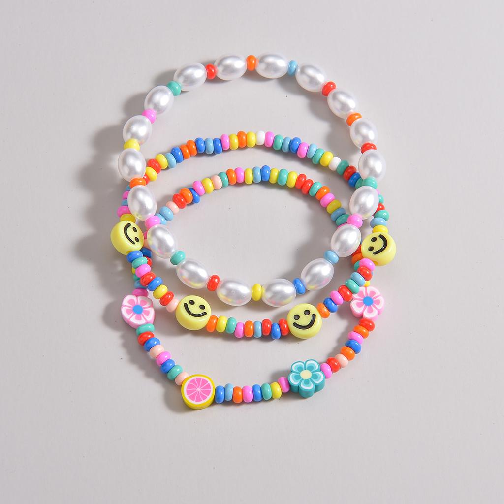 3-piece set of Bohemian style colorful rice beads mixed with smiling face pearls, multiple layered women's anklets
