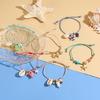 Keramik-Meerestier-Anhänger, geflochtenes Armband, verstellbares Seildesign mit Seestern- und Muschel-Charm, lässiger Schmuck
