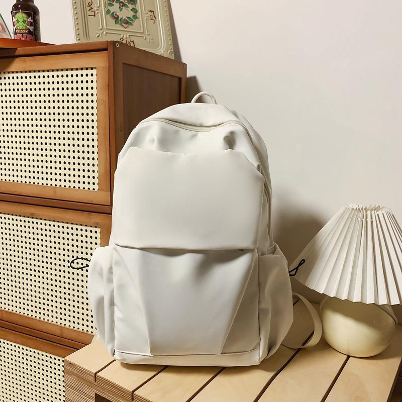 

Чоловічий і жіночий одноколірний нейлоновий рюкзак для учнів середньої школи бежевий