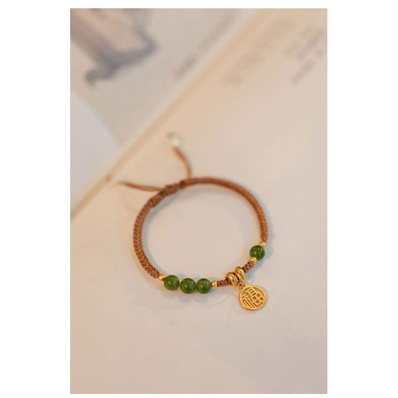 

Новый браслет с пряжкой мира в китайском стиле, приносящий удачу, для женщин, нишевый дизайн, ретро-темперамент, регулируемый зеленый плетеный ремешок для ношения Fukai