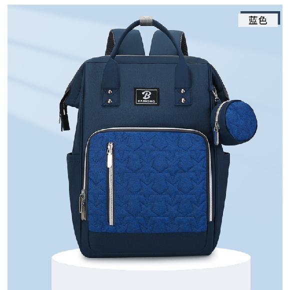 New style mommy bag with large capacity, featuring a patchwork design, contrasting colors, and a versatile, fashionable look. It’s a waterproof