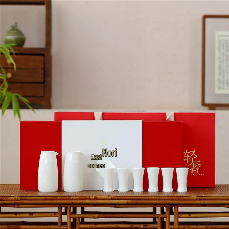 Antique-Style Sheep Fat Jade Porcelain Wine Set: Baijiu Cups, Decanter, Sake Pot, and Small Ceramic Wine Cups.