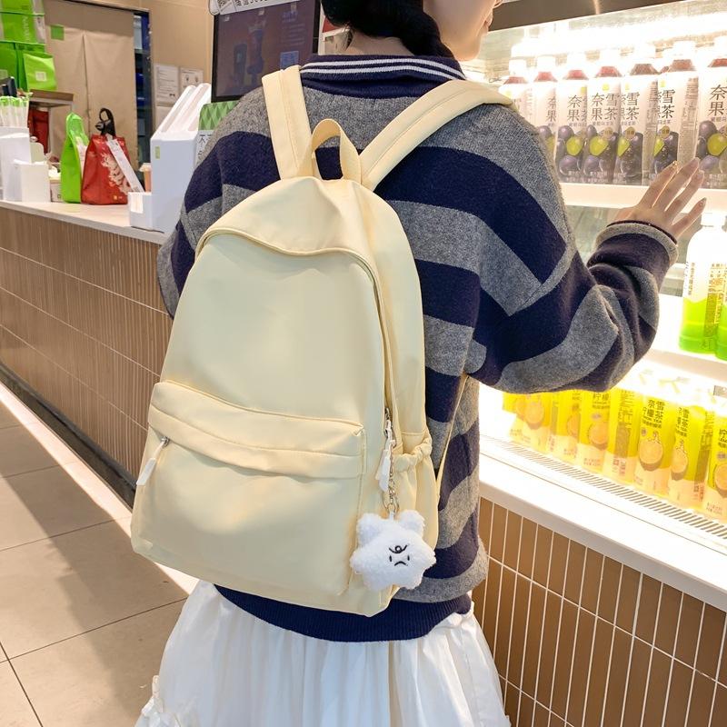 Solid color simple daily commuter student backpack Korean version casual style large capacity junior high school student backpack