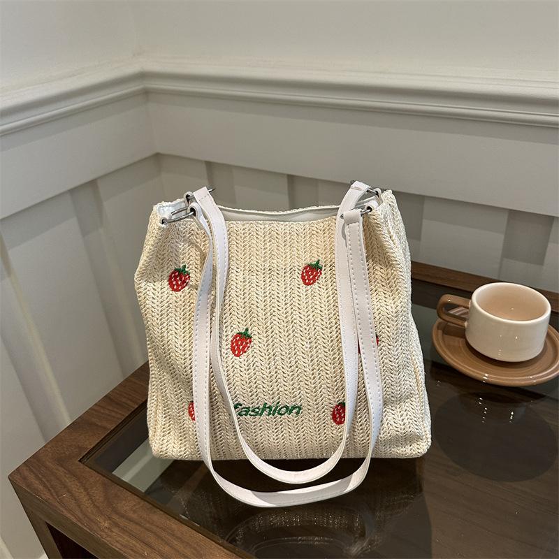 Versatile seaside beach vacation straw bag 2025 new shoulder large capacity fashionable strawberry embroidered bucket bag