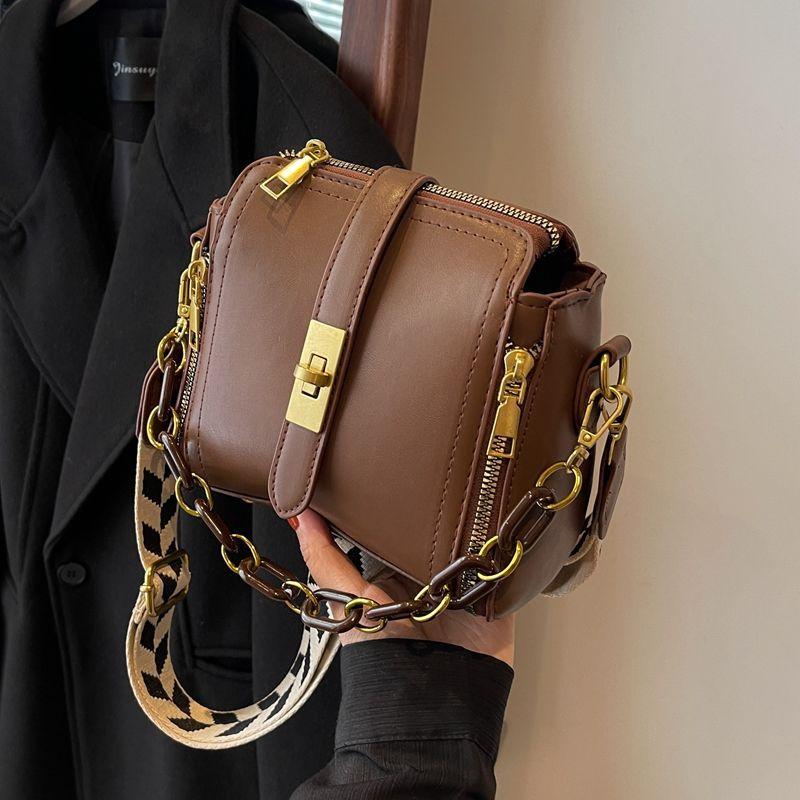 

This year s popular bags are women s new trendy winter and spring versatile atmospheric broadband shoulder messenger bags fashionable bucket bags. коричневий