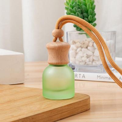 1 Stück nachfüllbare Auto ätherisches Öl Diffusor Flasche 11 ml Leerer Auto Lufterfrischer Anhänger Parfüm Glasflasche mit Holzkappen