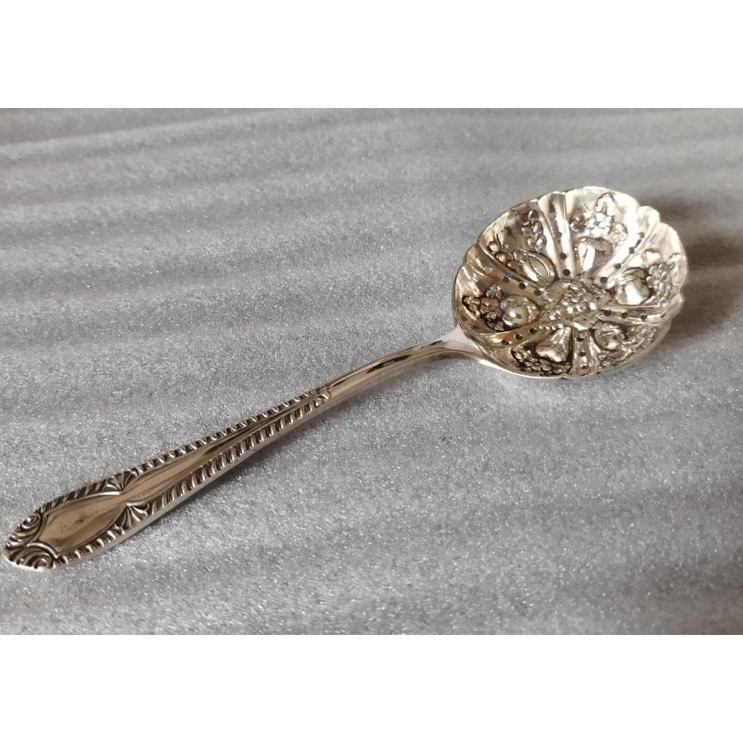 Used British antique sugar shifter spoon in good condition