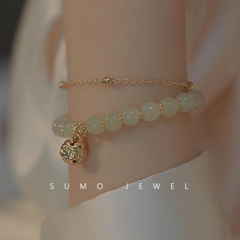 

Wind chimes ring, a friend returns. Natural Hetian jade bracelet for women, unique design with bell pendant, a gift for a daughter Bracelet One size fits al