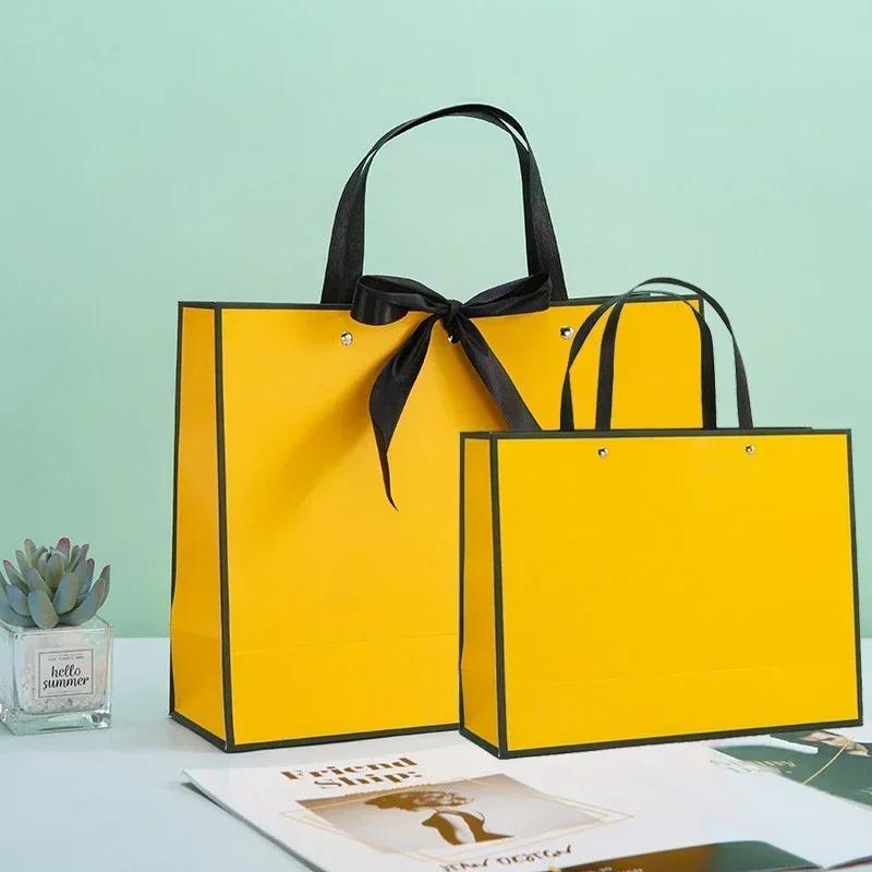 White Paper Jam Handbag Kraft Paper Thick Waterproof Frame Rivet Handle Gift Bag Cosmetic Clothing Store Portable Packaging Bags