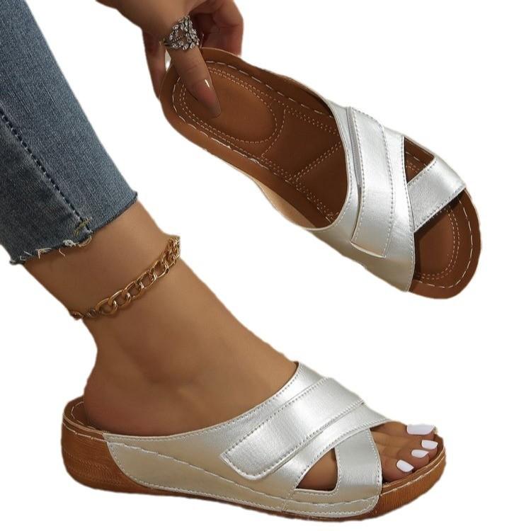 Large size hollow Roman wind slope heel slippers European and American summer new one-character fish mouth slippers