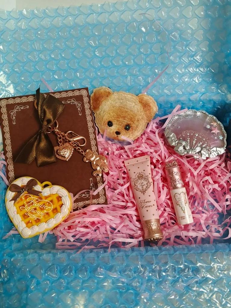 Flower Knows Surprise Blind Box Set (3-4 products) with randomly included items such as eyeshadow, blush, lipstick, and small accessories.
