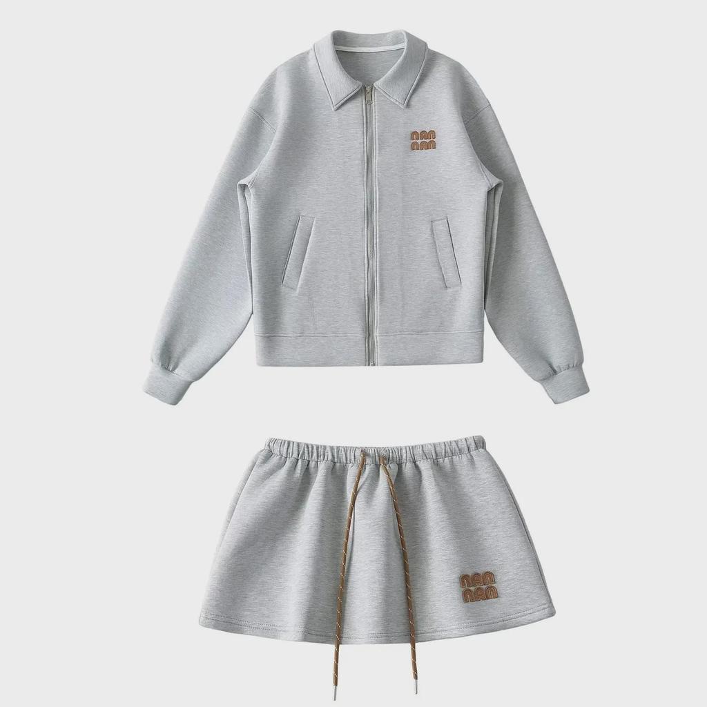 "Sweet Sports Style Mini Skirt: Elastic Waist, Air Layer Embroidery, Anti-Exposure, Versatile Sweater Material for Women."