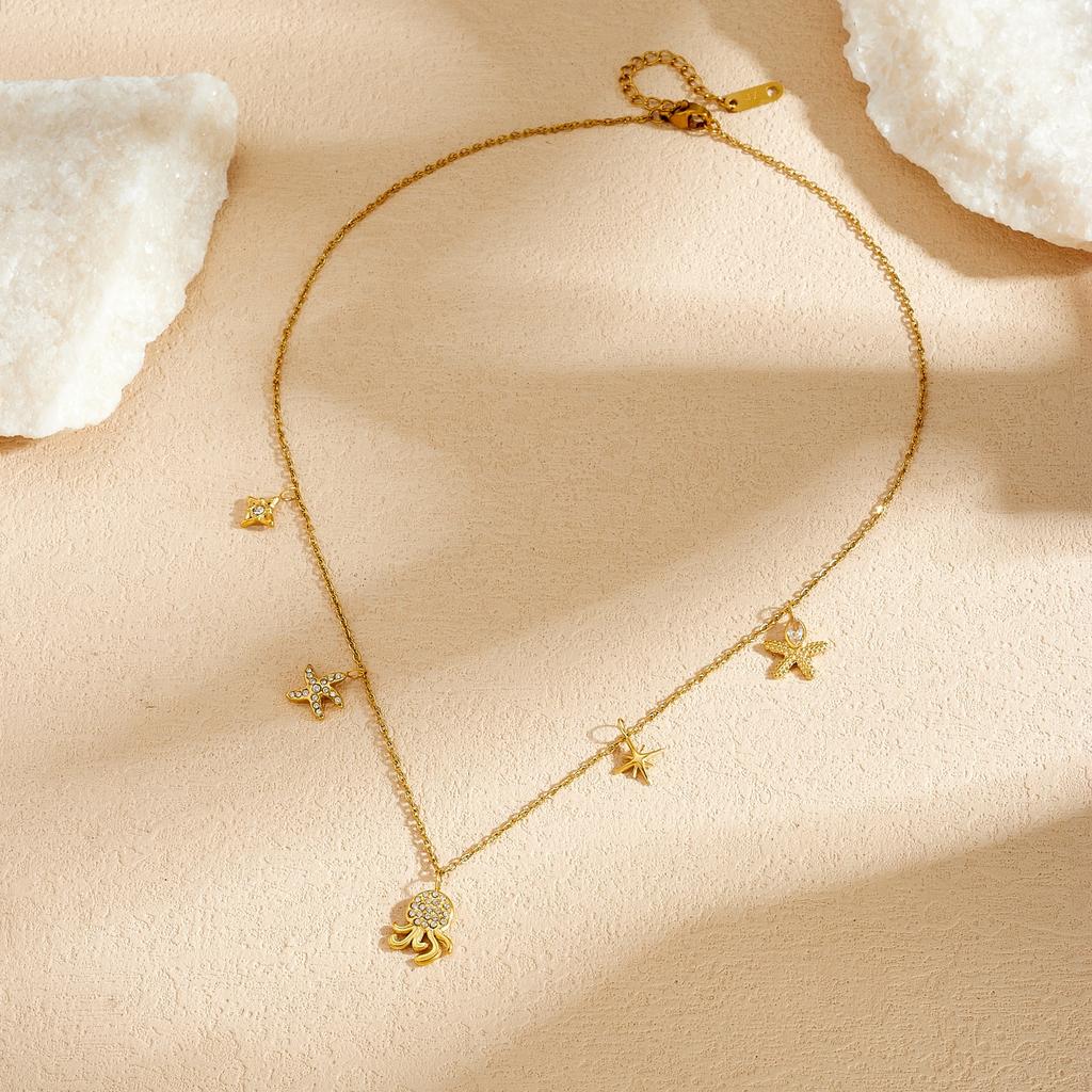 DIEYURO 316L Stainless Steel Golden Octopus Starfish Inlay Zircon Star Pendant Necklace for Women Ocean Neck Chain Jewelry Gift