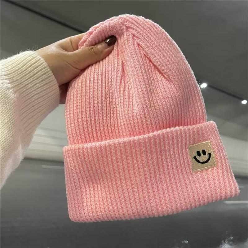 Devil smiley face label wool hat women's autumn and winter warm trend versatile ear protector black knitted hat
