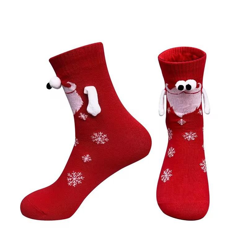 A pair of socks Fabric Christmas Socks - 3D Eyes Magnetic Cartoon Design, Hand-in-Hand Mid-Calf Playful Holiday Gift