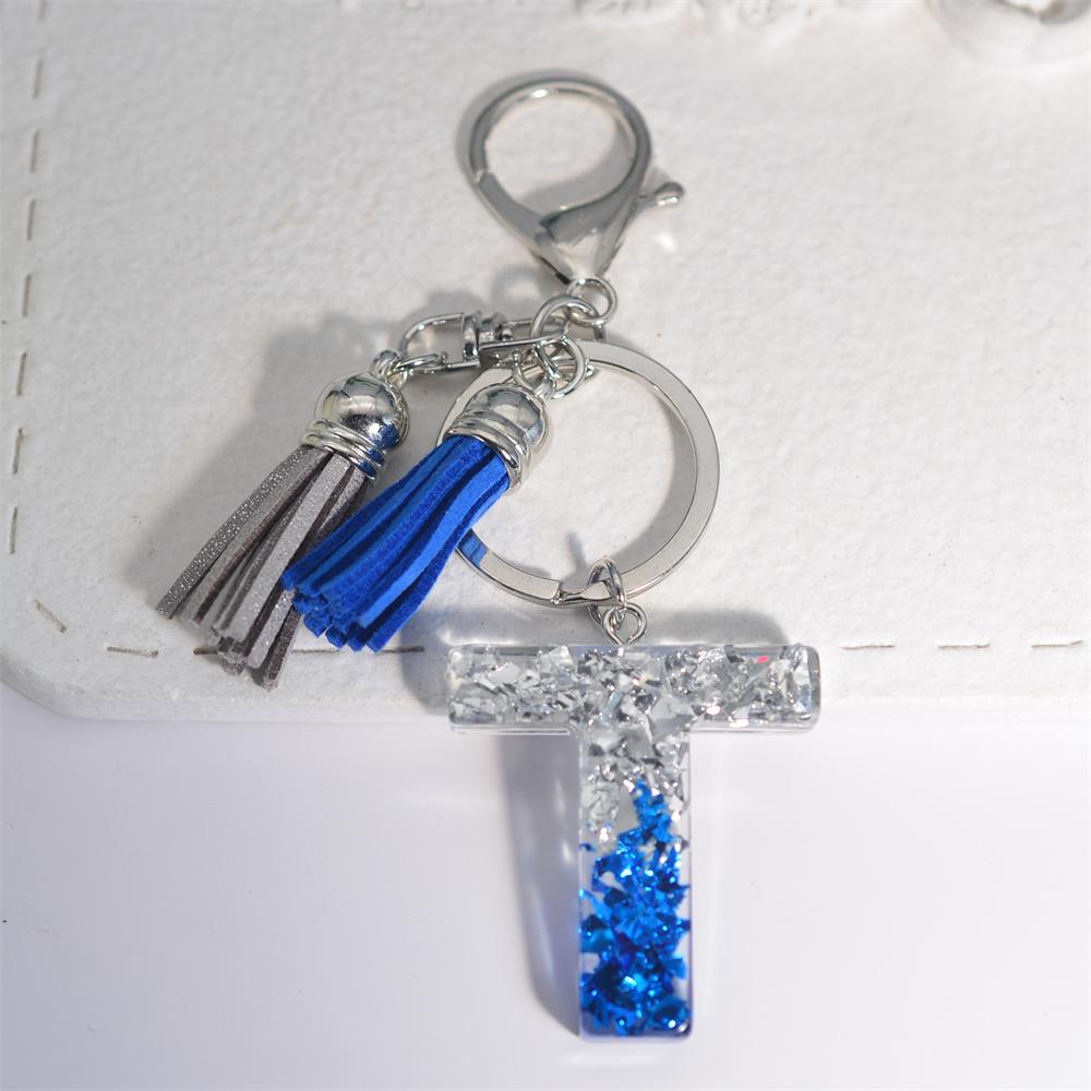 Креативные брелки из смолы с 26 буквами и кисточками — фото 25