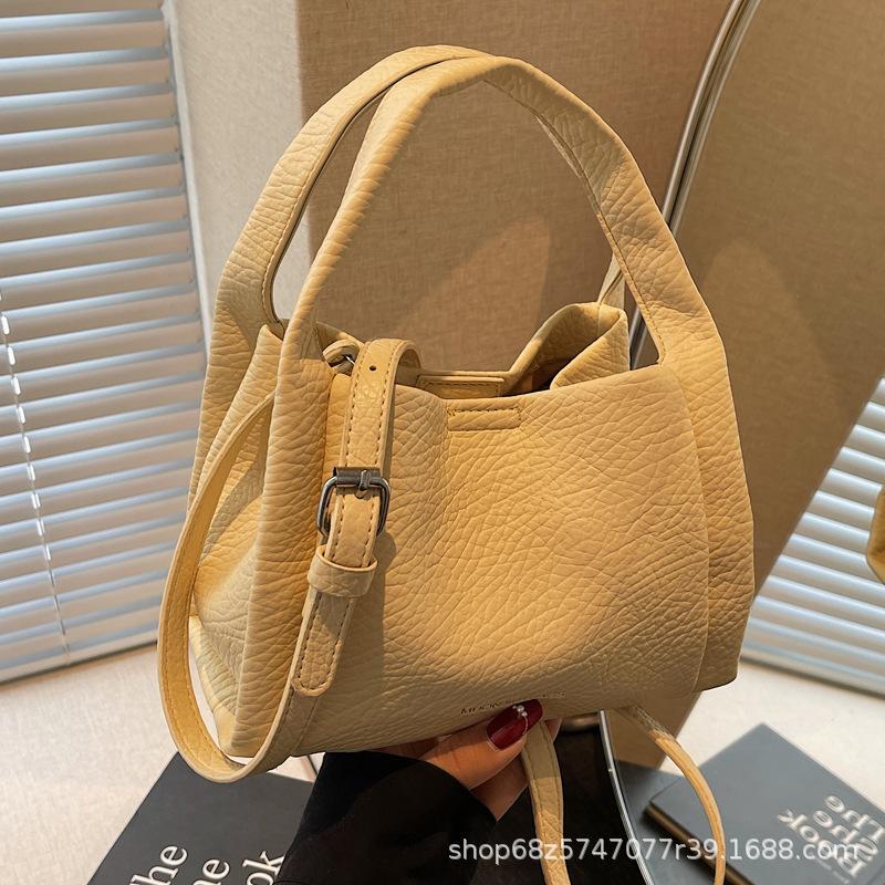 High-end hand-held bucket bag women's new 2025 trendy fashion shoulder bag niche simple casual crossbody bag