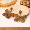 Vintage Butterfly Alloy Earrings with Inlaid Diamonds: Retro and Luxurious Statement Jewelry for Women