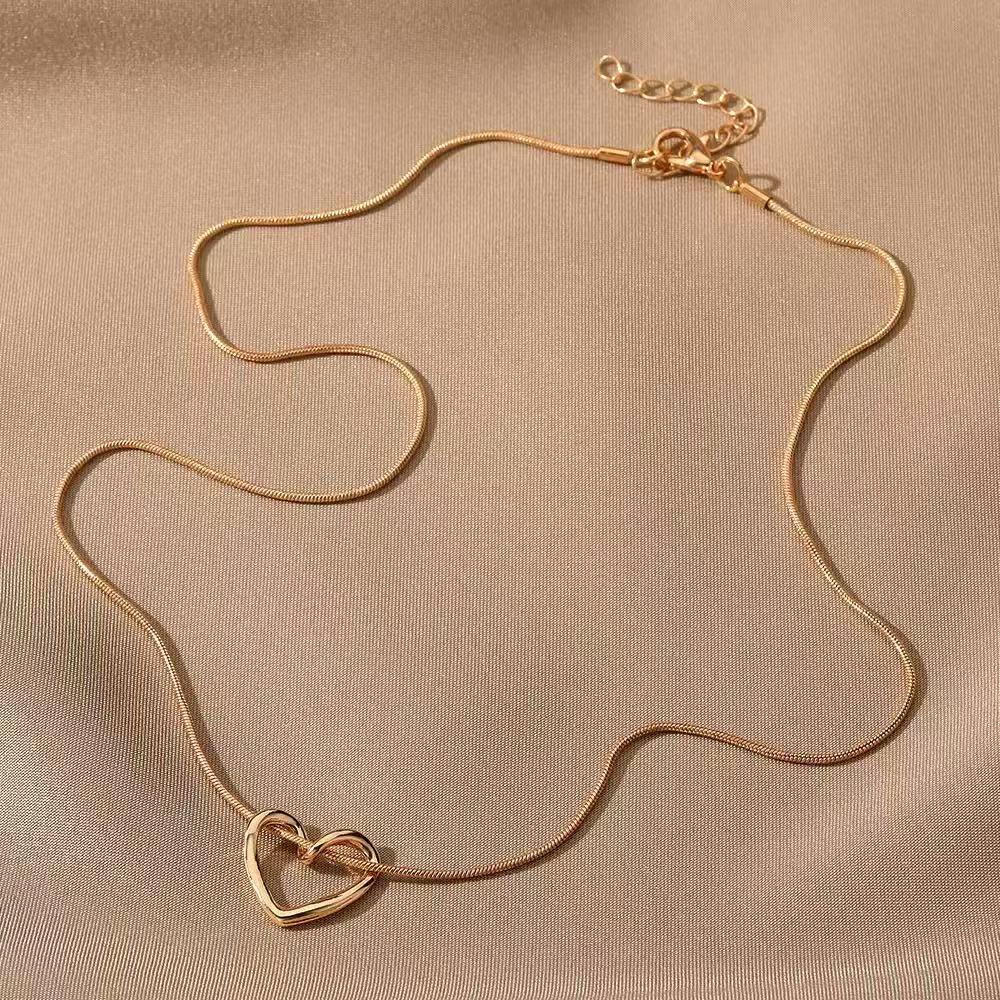 Elegant Titanium Steel Heart Necklace for Women - Hollow Design, Light Luxury, Versatile Clavicle Chain
